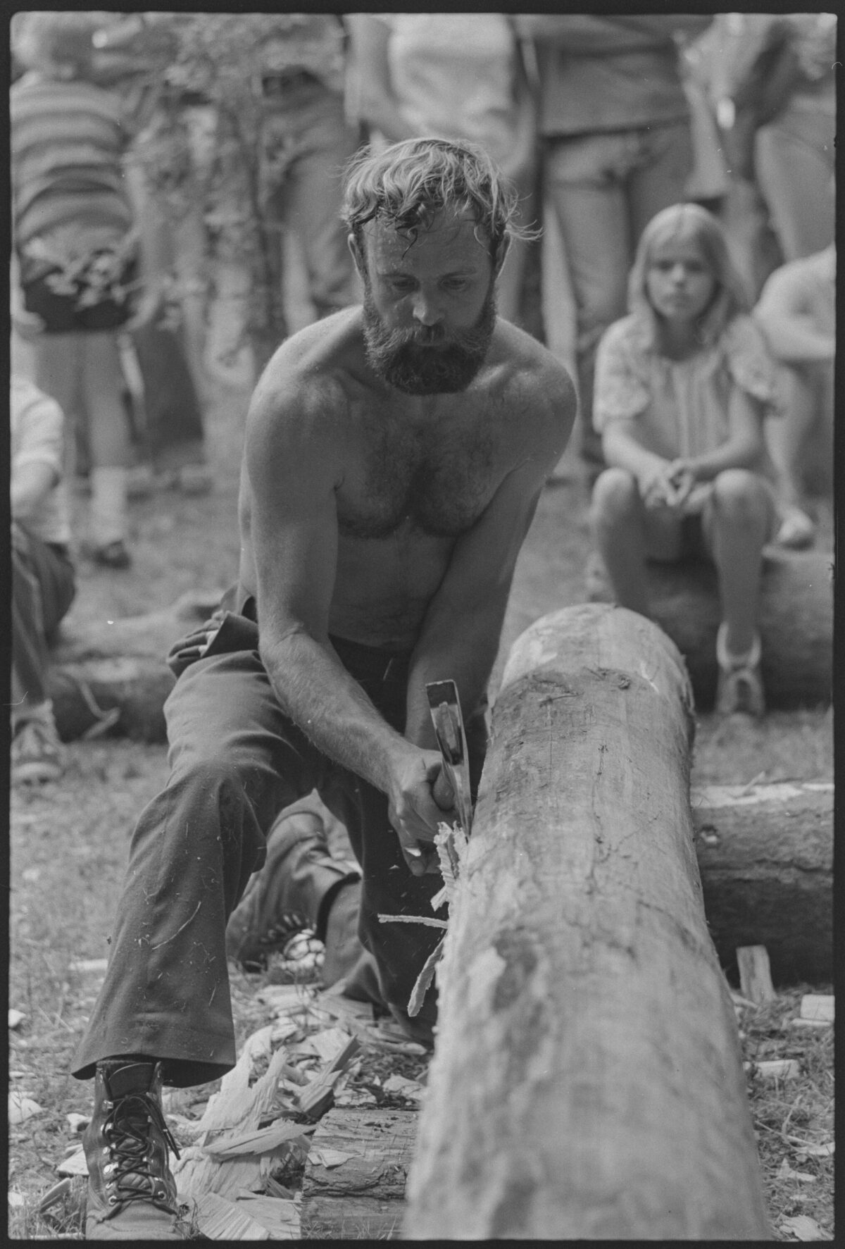 Peter Gott Hewing Logs for Log Cabin Construction